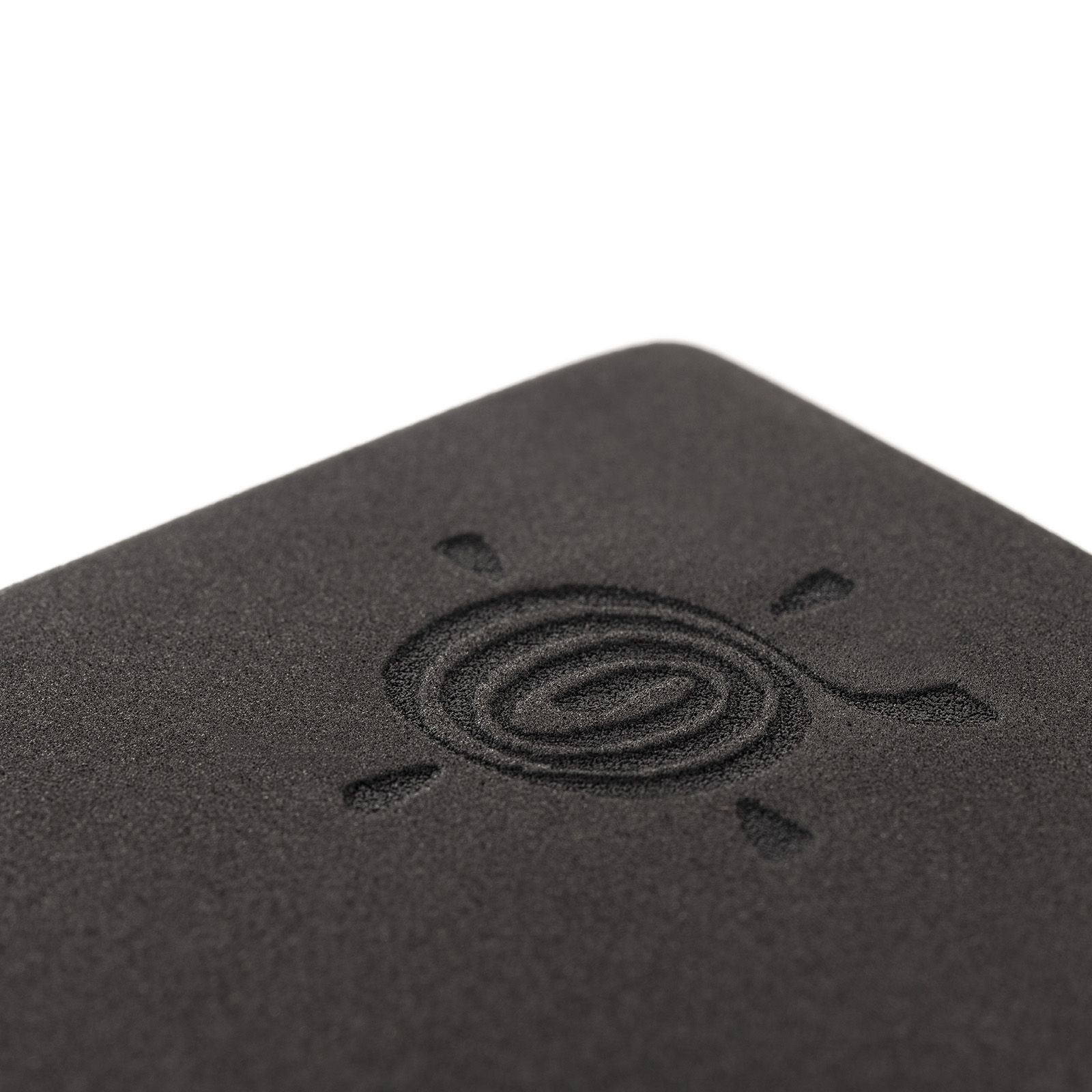 kurma_yoga_foam-block_brick_black_detail_LR kurma yoga foam brick black zoomed-in on logo